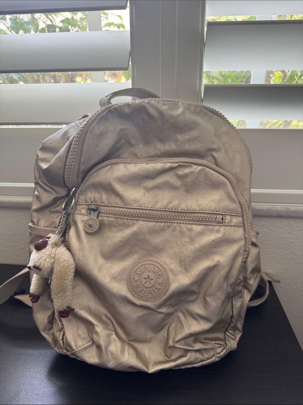 Kipling Metallic Champagne Backpack with Monkey Keychain